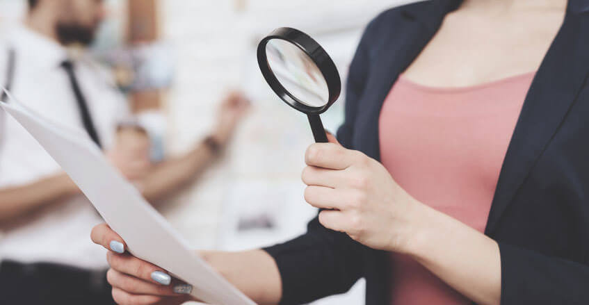 Woman Checking Paper